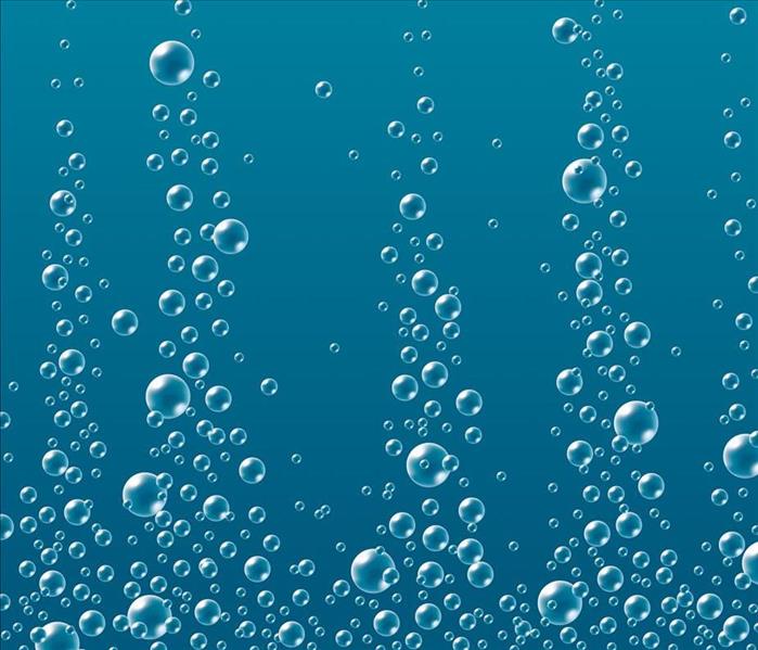 bubbles raising through blue colored water