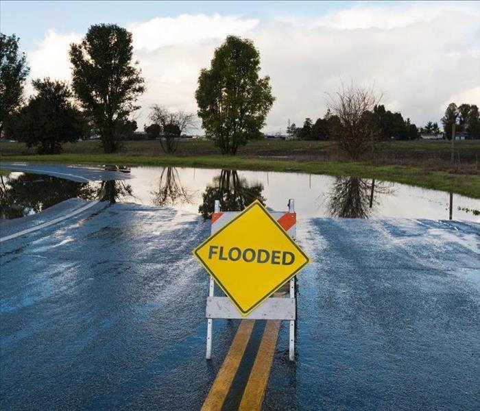 flooded sign road blocak wet road