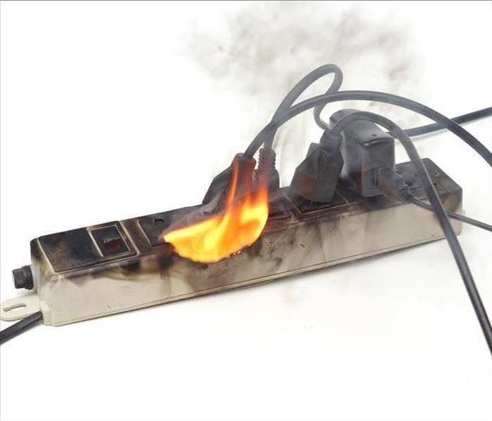overloaded extension outlet catching fire